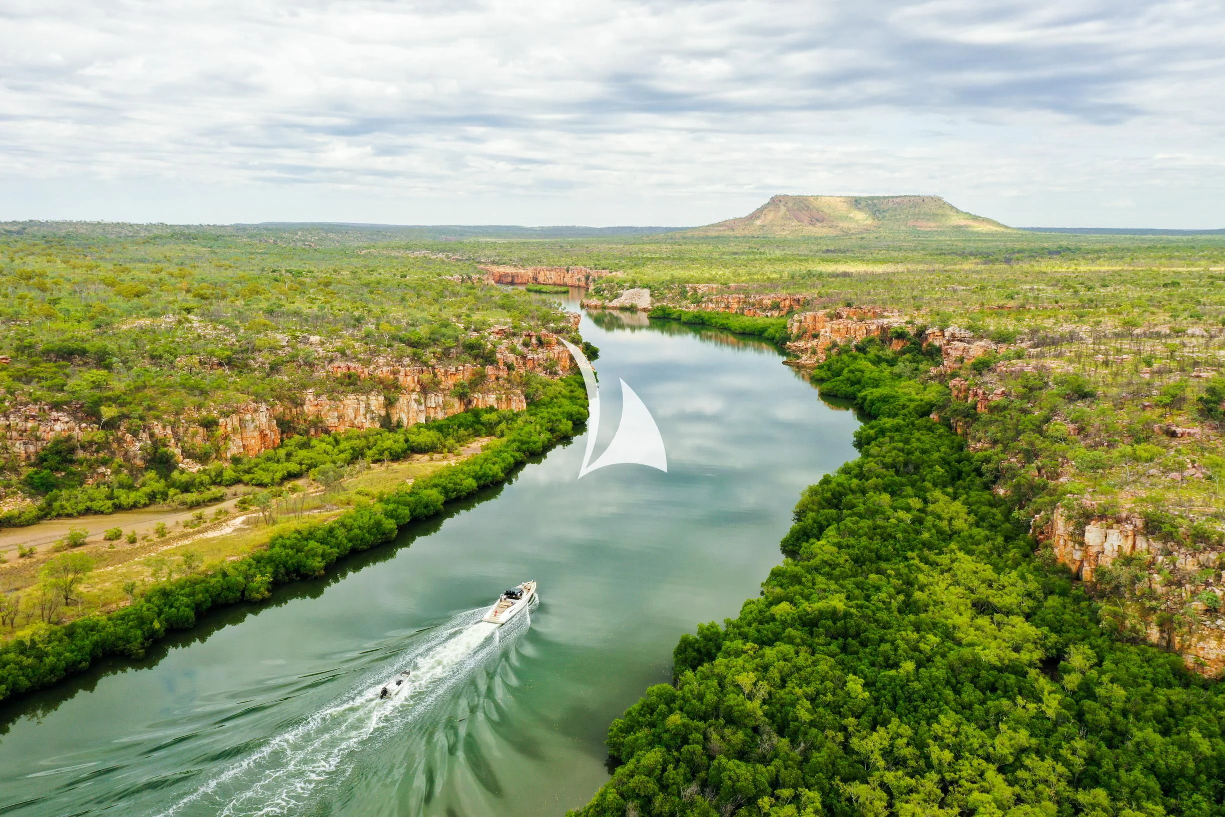 a river running through a green landscape aboard FELIX Yacht for Sale