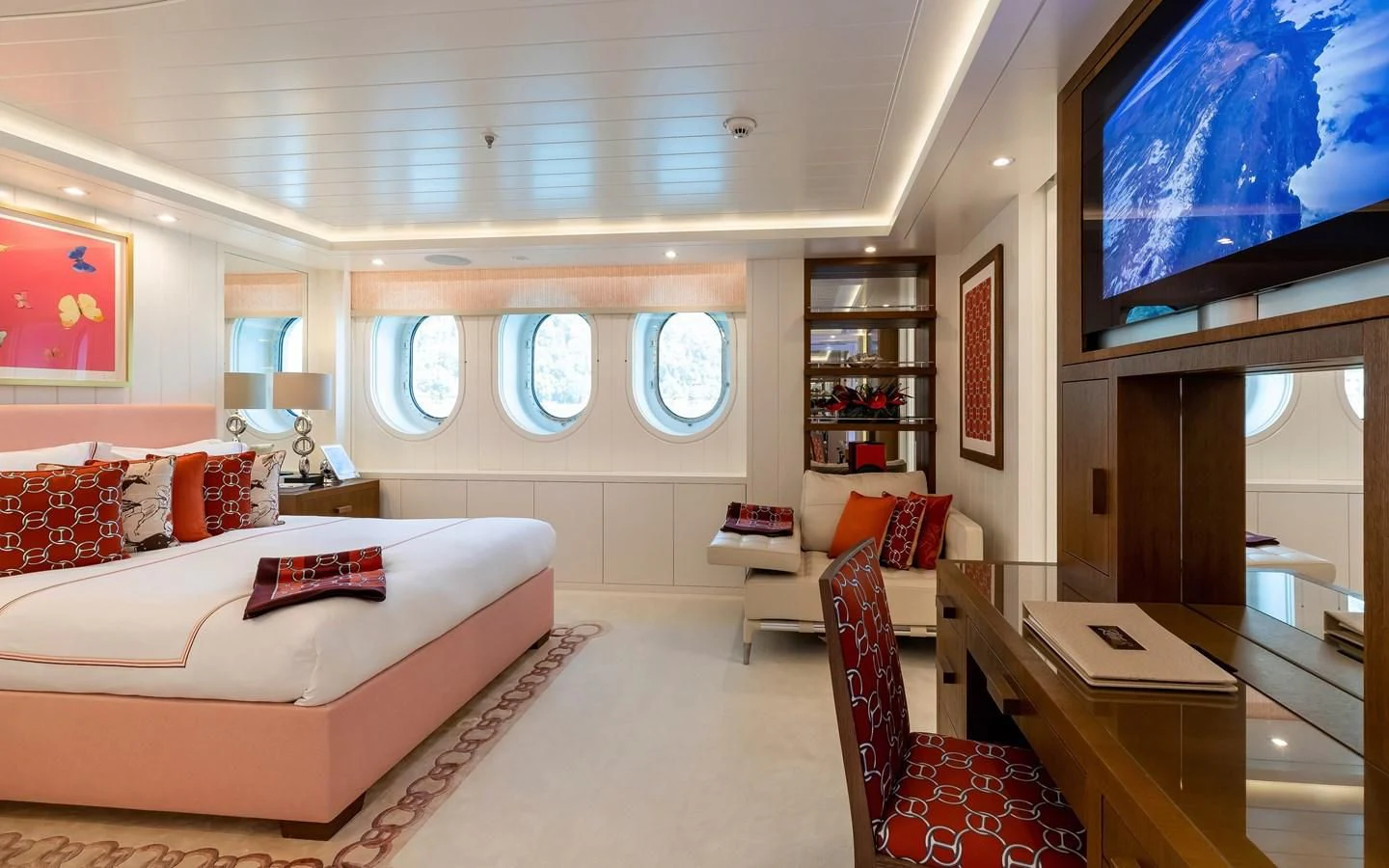 a room with a bed and a tv on the wall aboard FELIX Yacht for Sale