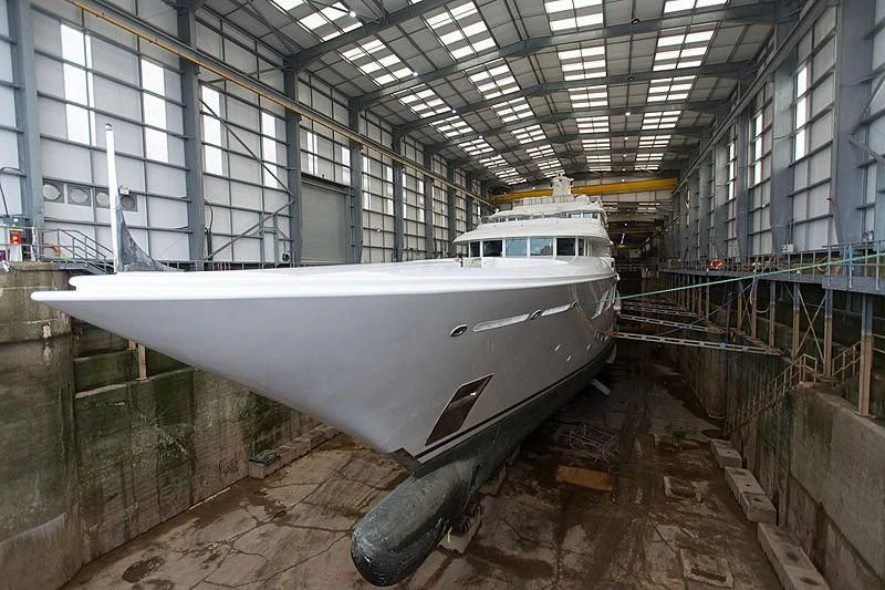 a white boat in a large building aboard FELIX Yacht for Sale