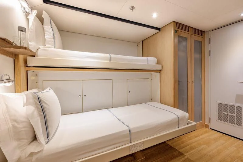 a room with a bed and a closet aboard FELIX Yacht for Sale