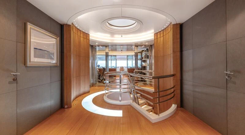 a room with a staircase and a glass door aboard FELIX Yacht for Sale