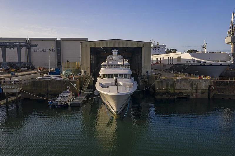 a boat docked at a pier aboard FELIX Yacht for Sale