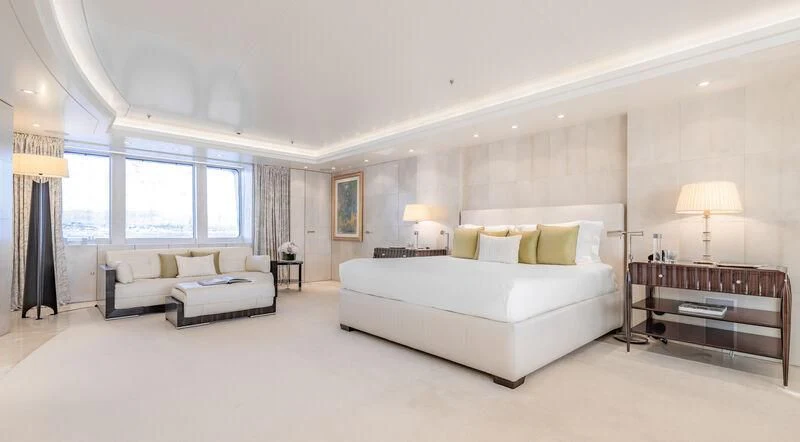 a large bedroom with a large bed aboard FELIX Yacht for Sale