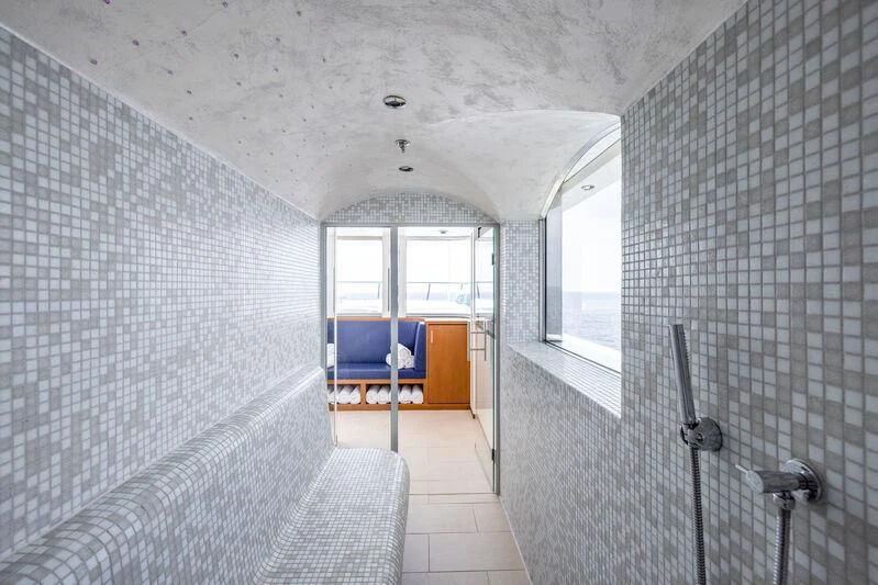 a room with a bed and a window aboard FELIX Yacht for Sale