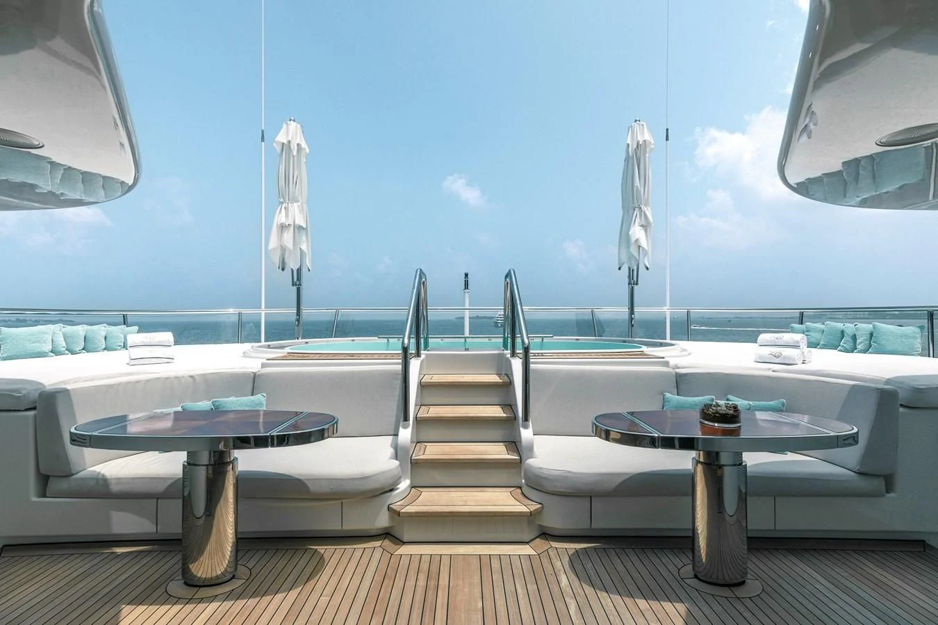 a table and chairs on a deck aboard FELIX Yacht for Sale