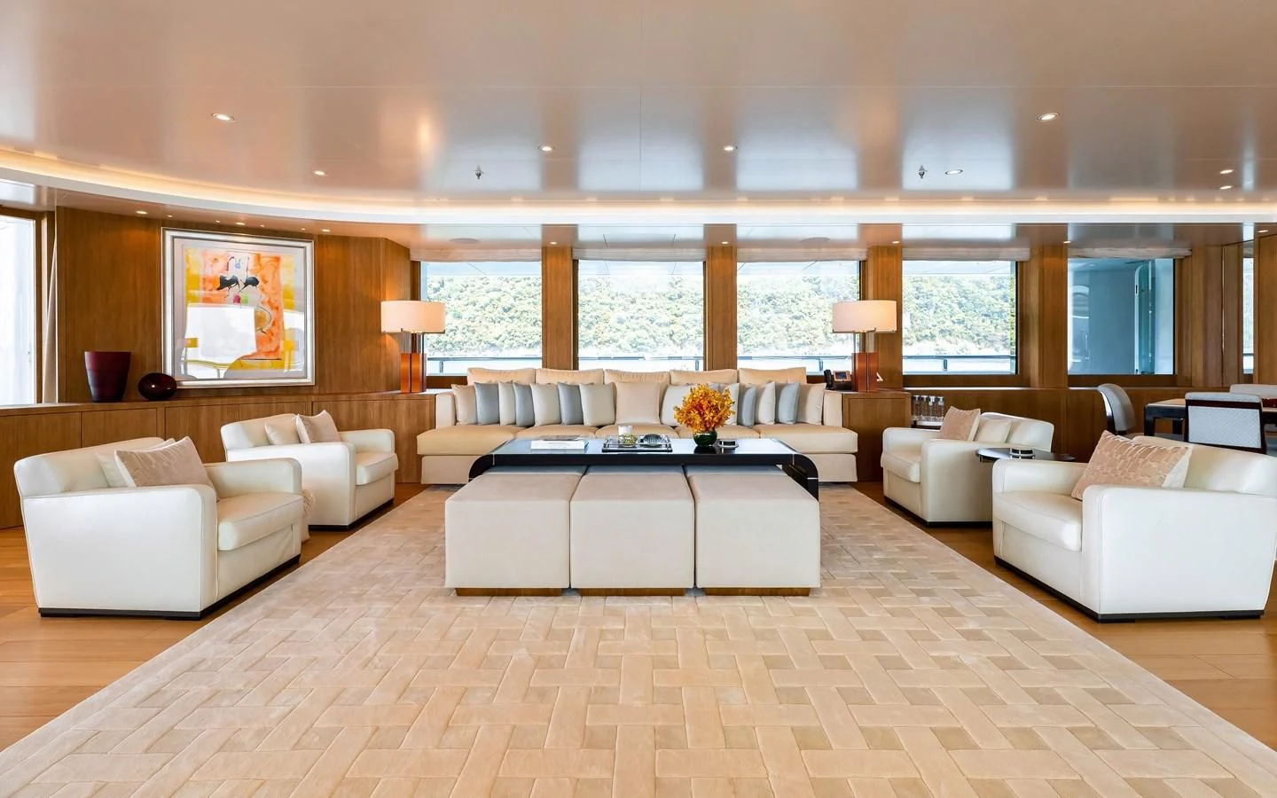 a large living room with a large table and a large window aboard FELIX Yacht for Sale
