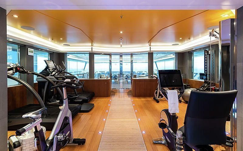 a room with a large window and a wood floor with a large window aboard FELIX Yacht for Sale