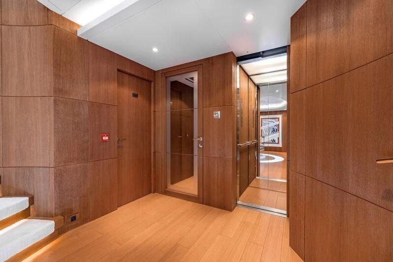 a room with wooden walls and wood floors aboard FELIX Yacht for Sale