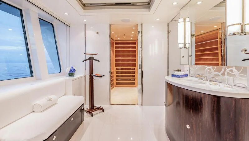 a bathroom with a tub sink and a mirror aboard FELIX Yacht for Sale