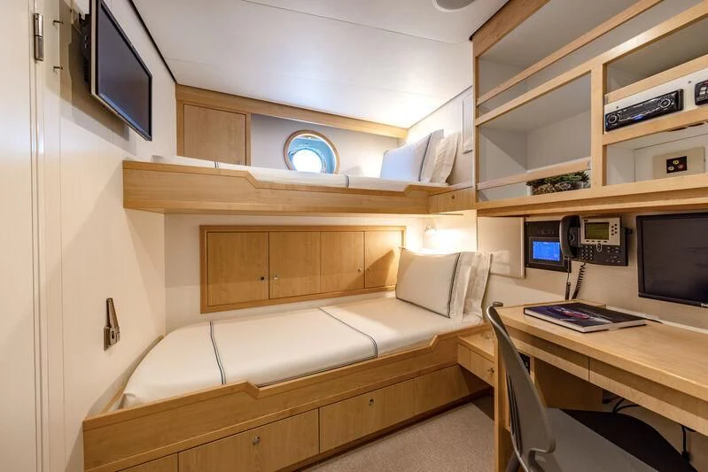 a room with a couch and a desk aboard FELIX Yacht for Sale