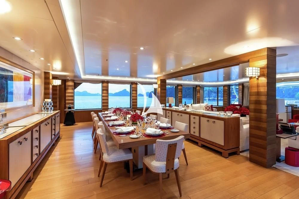 a large kitchen with a dining table aboard FELIX Yacht for Sale