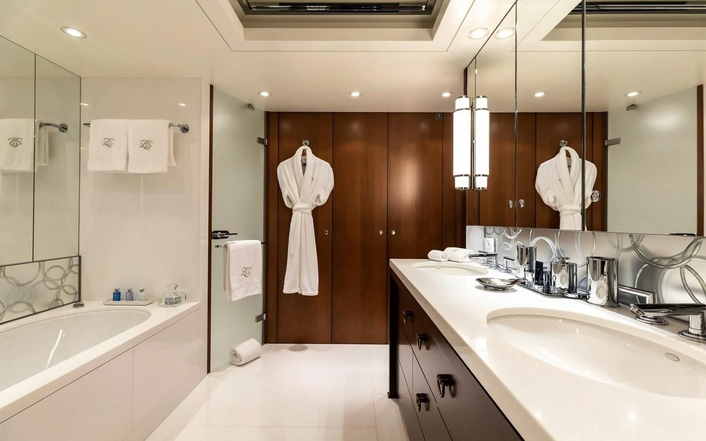a bathroom with a large mirror aboard FELIX Yacht for Sale