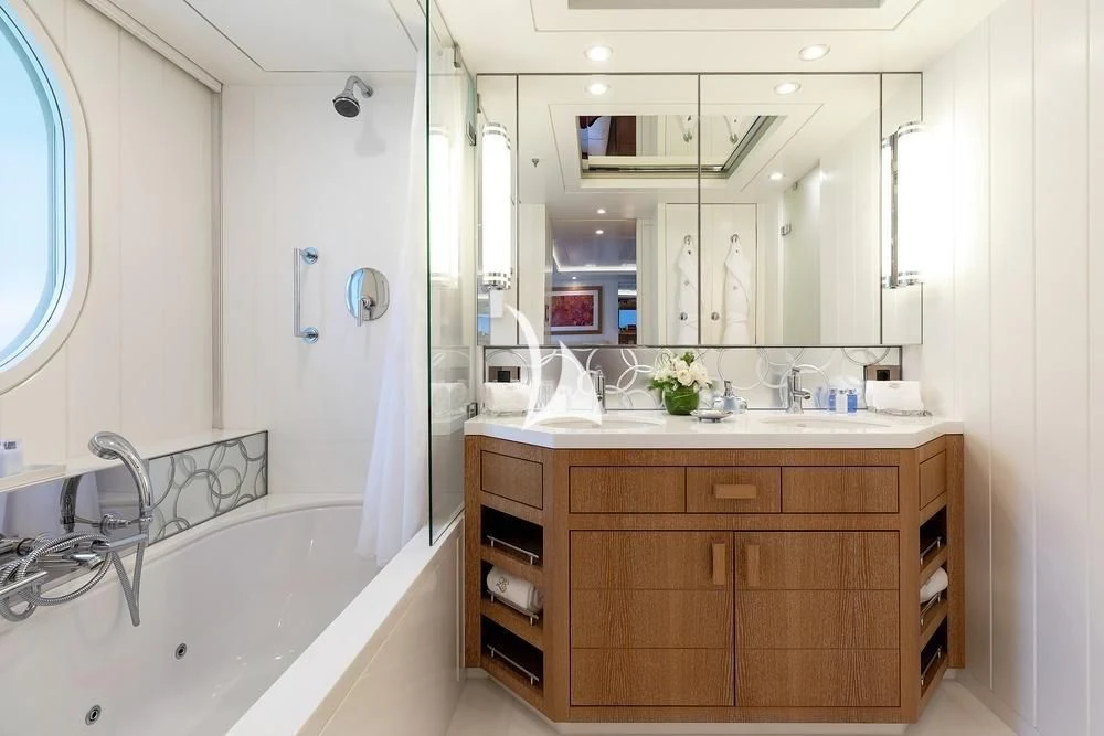 a bathroom with a large mirror aboard FELIX Yacht for Sale