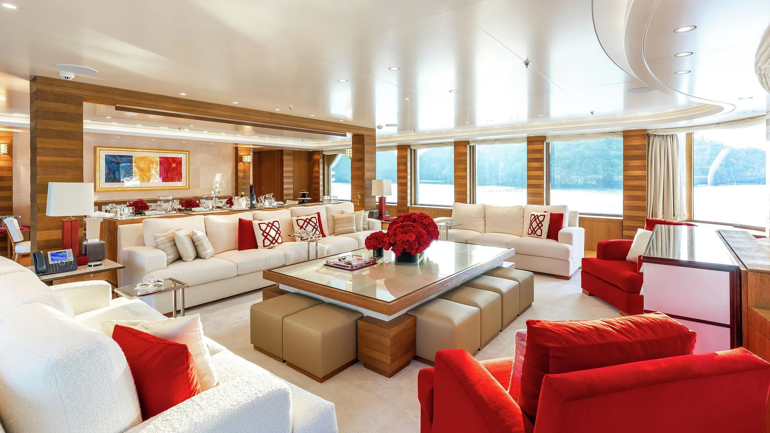 a living room with a table and couches aboard FELIX Yacht for Sale