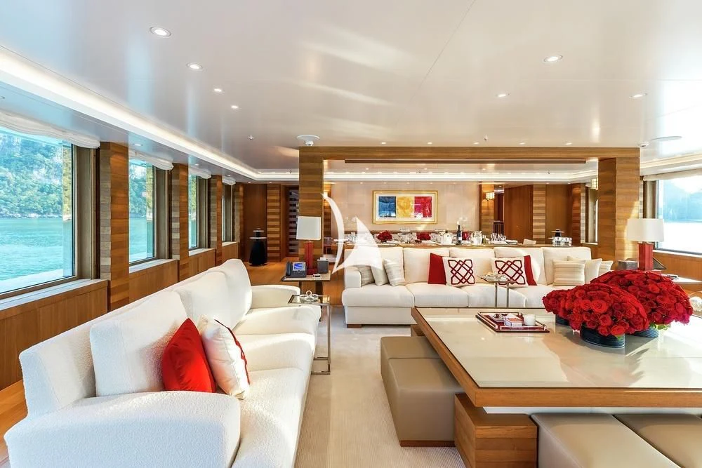 a living room with a large sofa aboard FELIX Yacht for Sale