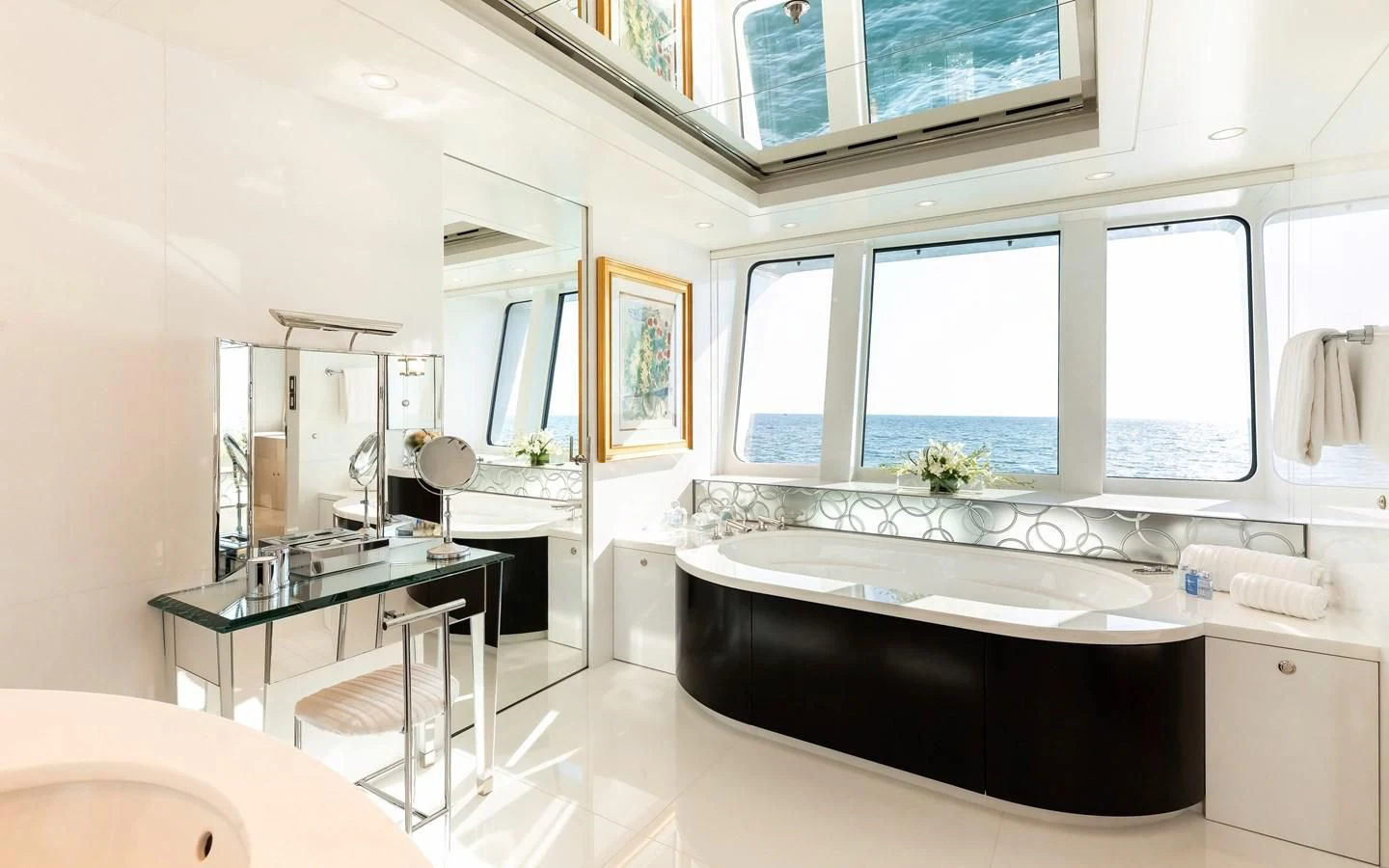 a bathroom with a tub sink and a large window aboard FELIX Yacht for Sale