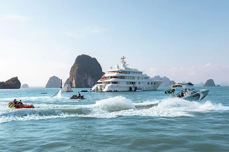 a group of people in boats in the ocean aboard FELIX Yacht for Sale