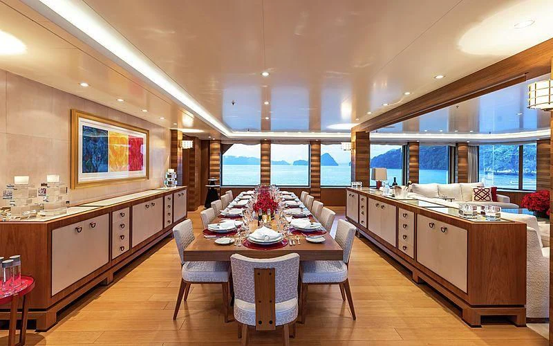 a large kitchen with a dining table aboard FELIX Yacht for Sale