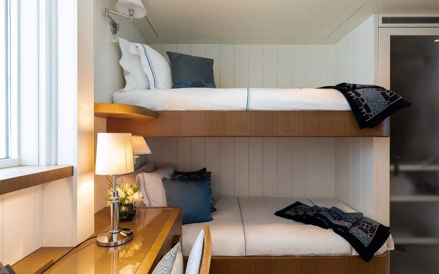 a bed with white sheets and pillows aboard FELIX Yacht for Sale