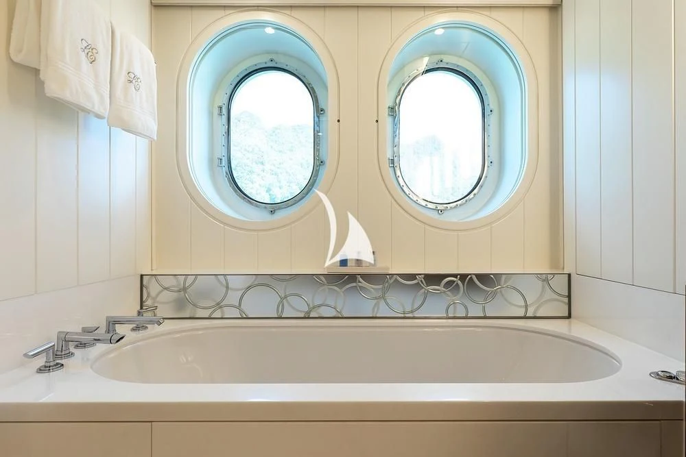 a bathroom with a large mirror aboard FELIX Yacht for Sale