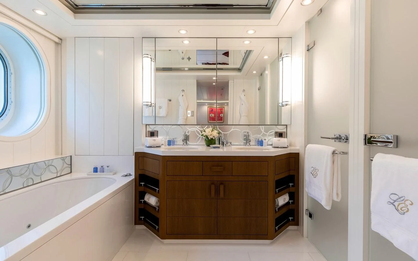 a bathroom with a large mirror aboard FELIX Yacht for Sale