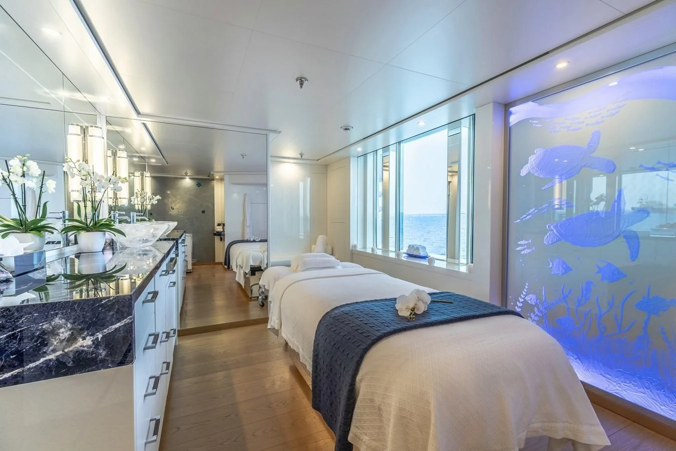 a bedroom with a large window aboard FELIX Yacht for Sale