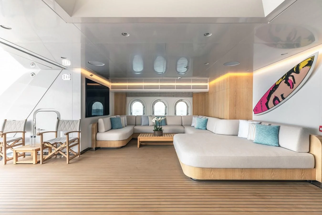 a living room with a couch and a table aboard FELIX Yacht for Sale