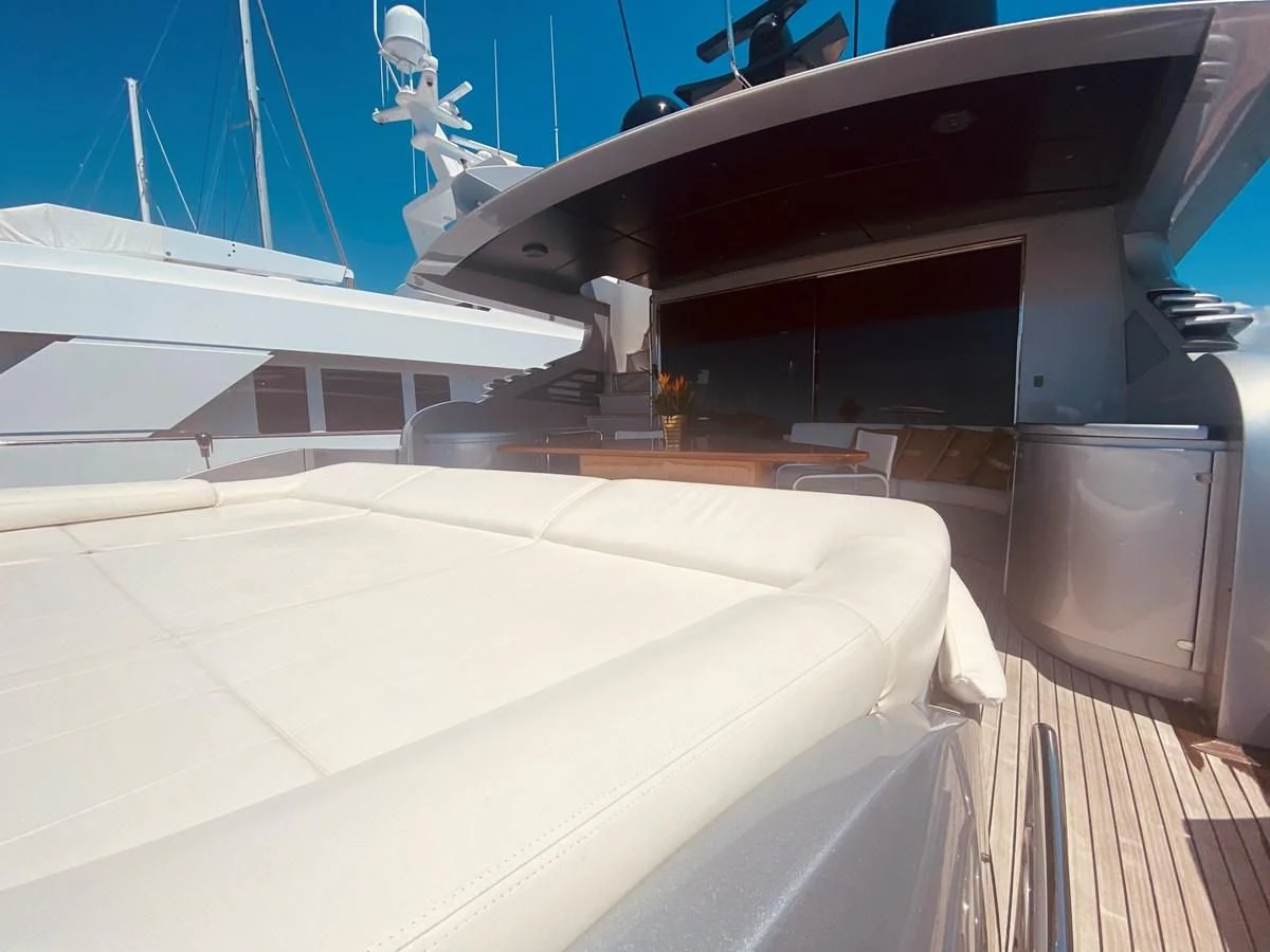 a boat with a table and chairs aboard ROMPEMAR Yacht for Sale