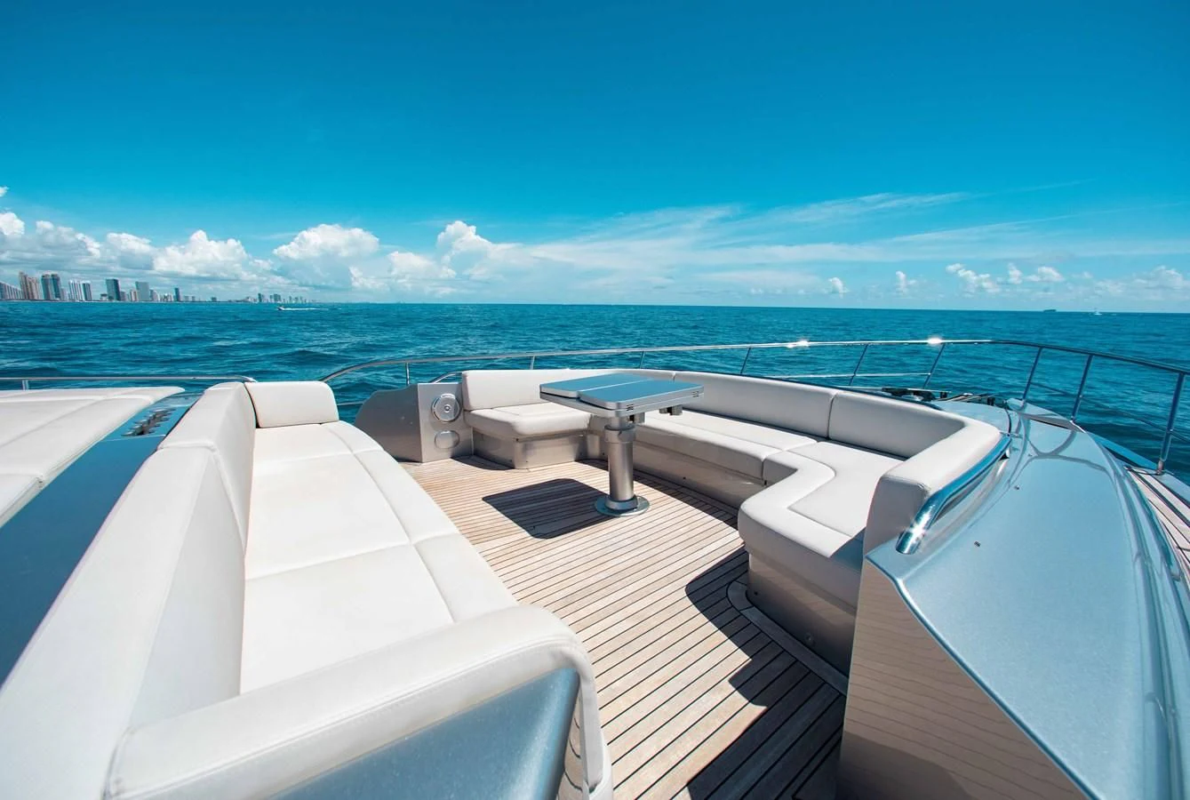 a deck with a view of the ocean and a city aboard LADY K Yacht for Sale
