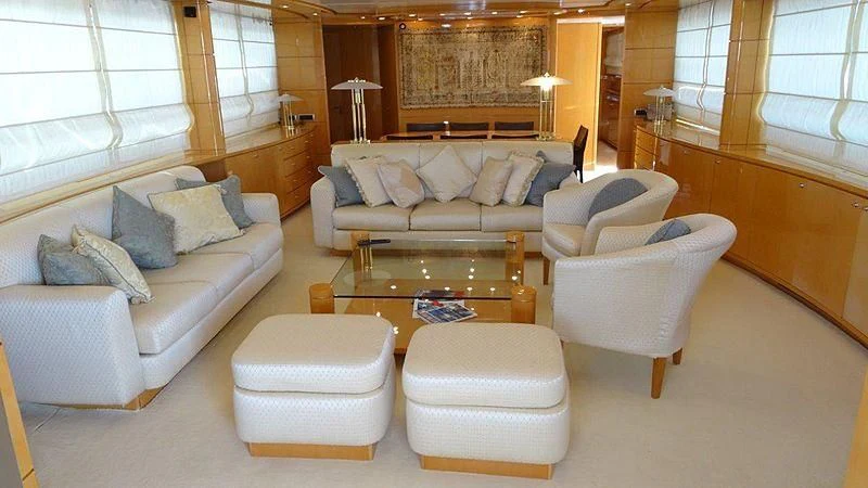 a living room with a couch and a coffee table aboard SHERAN Yacht for Sale