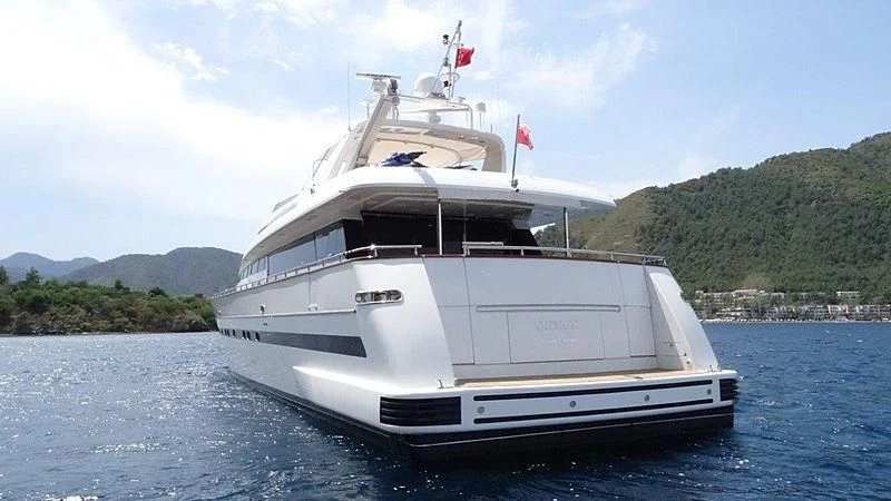 a white boat on water aboard SHERAN Yacht for Sale