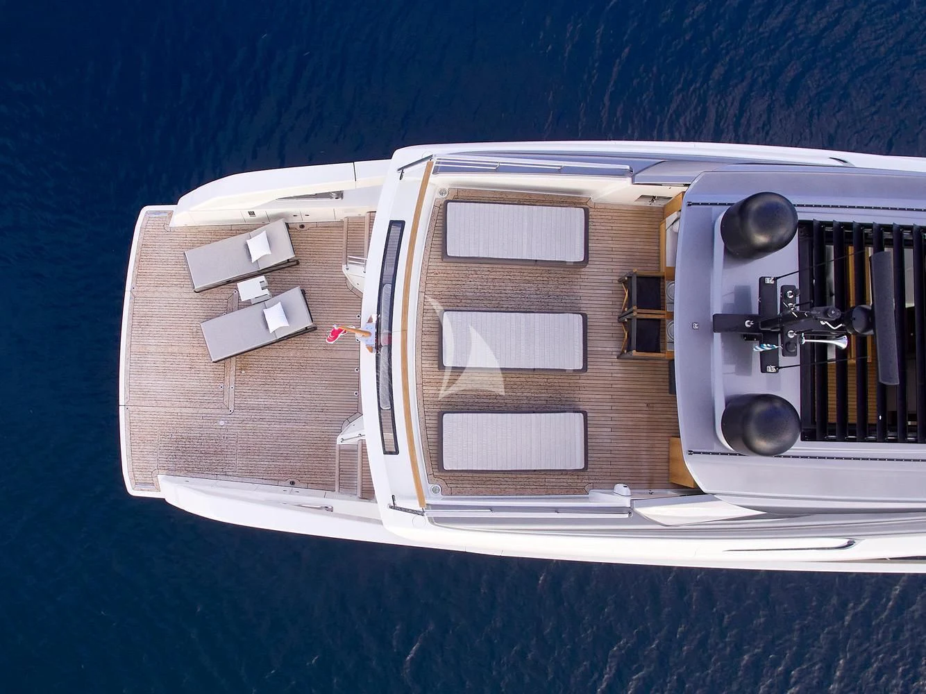 a white boat on a trailer aboard ZILVAR IV Yacht for Sale