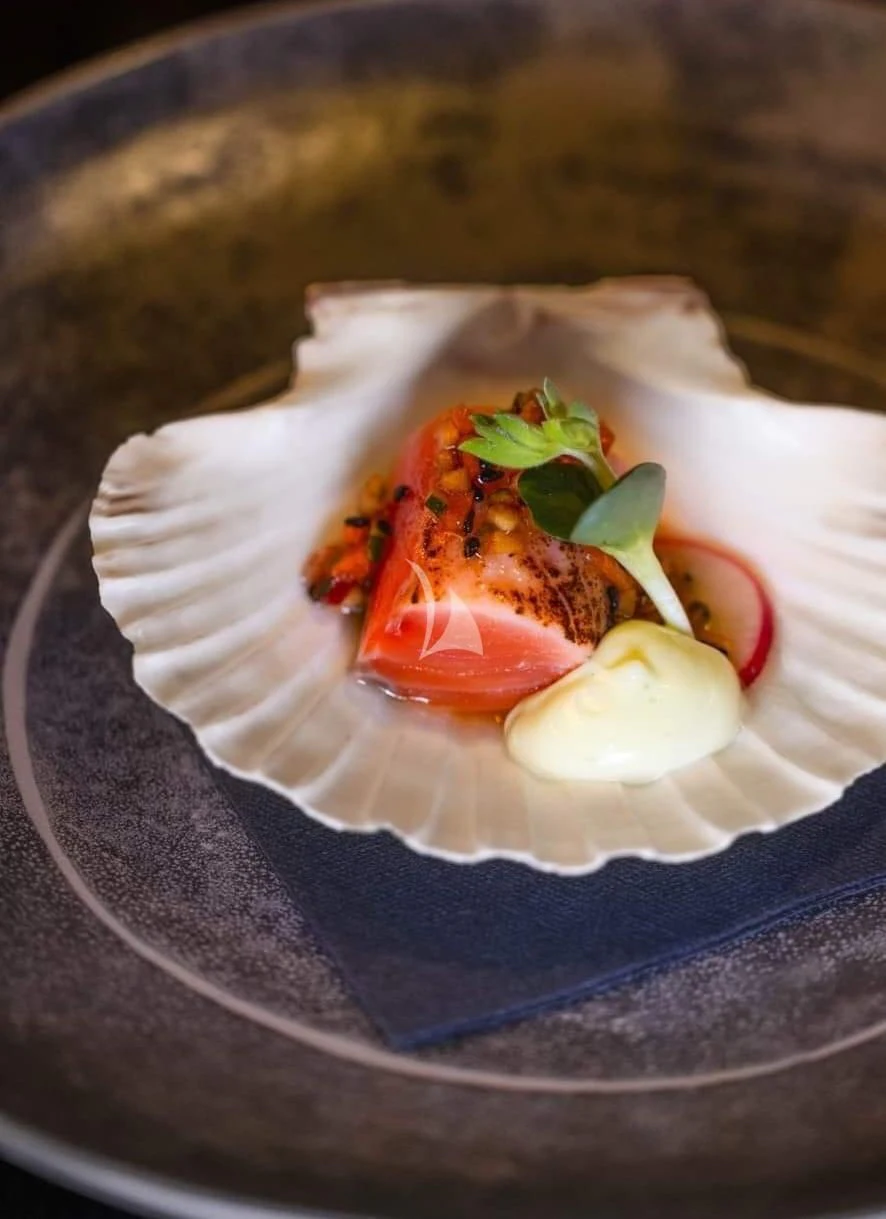 a plate of food aboard ZILVAR IV Yacht for Sale
