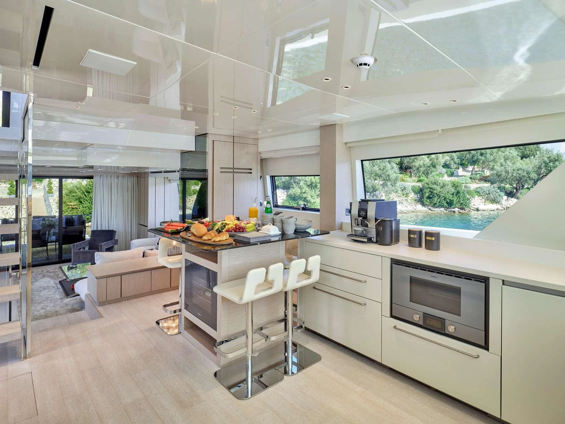 a kitchen with a table and chairs aboard ZILVAR IV Yacht for Sale