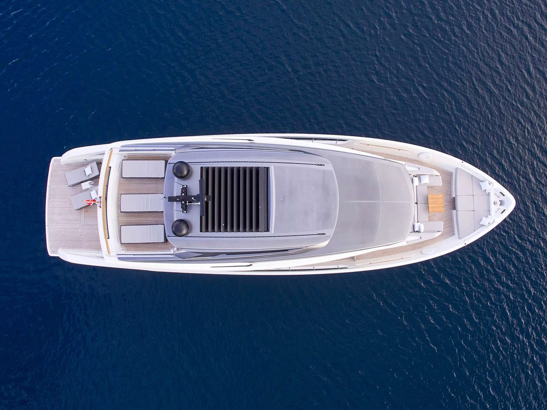 a white rectangular object with a silver panel on a blue surface aboard ZILVAR IV Yacht for Sale