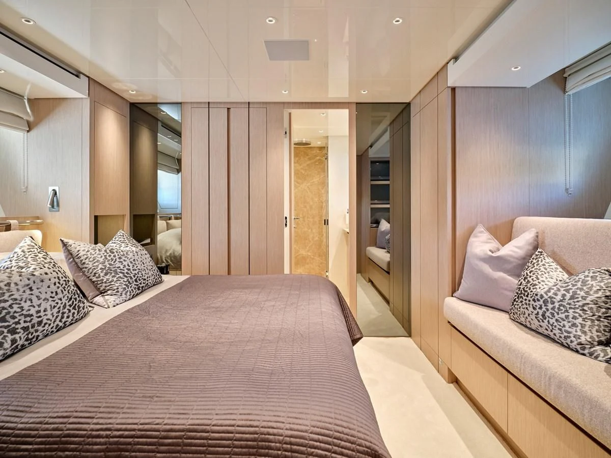 a bed in a room aboard ZILVAR IV Yacht for Sale