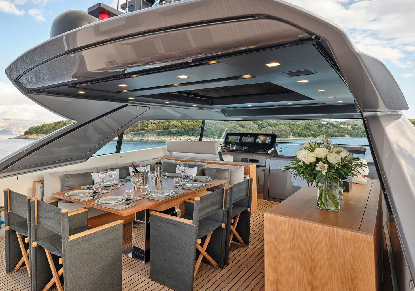 a large room with a table and chairs aboard ZILVAR IV Yacht for Sale