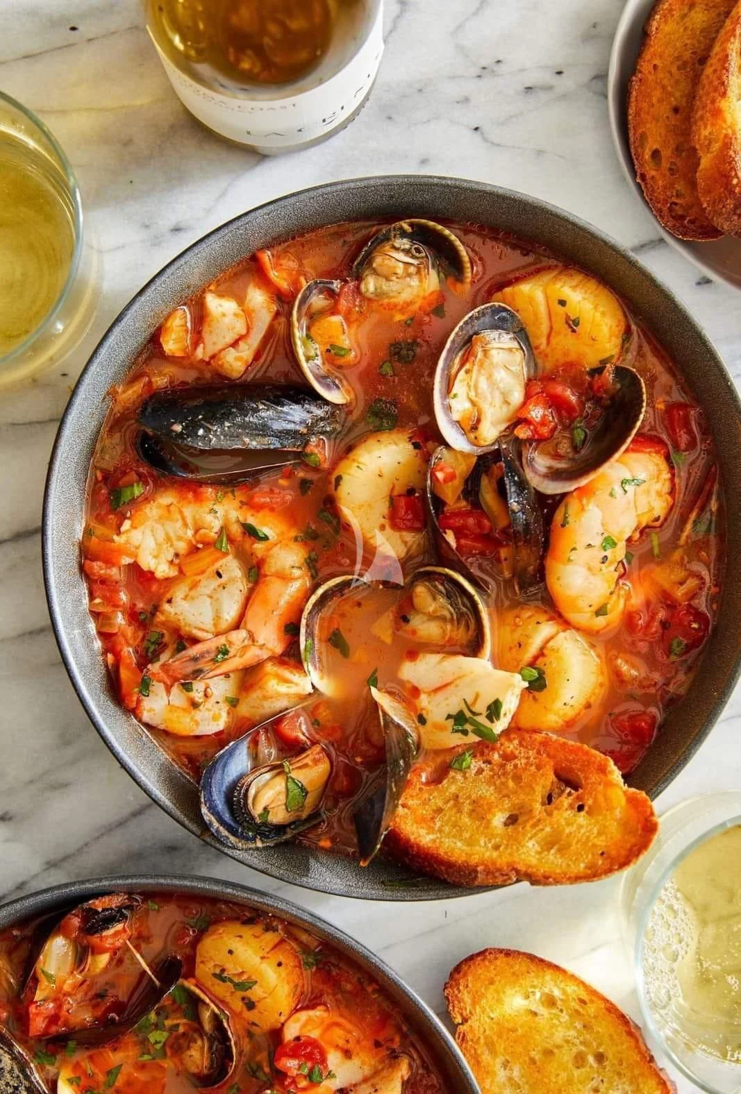 a pan full of seafood aboard ZILVAR IV Yacht for Sale