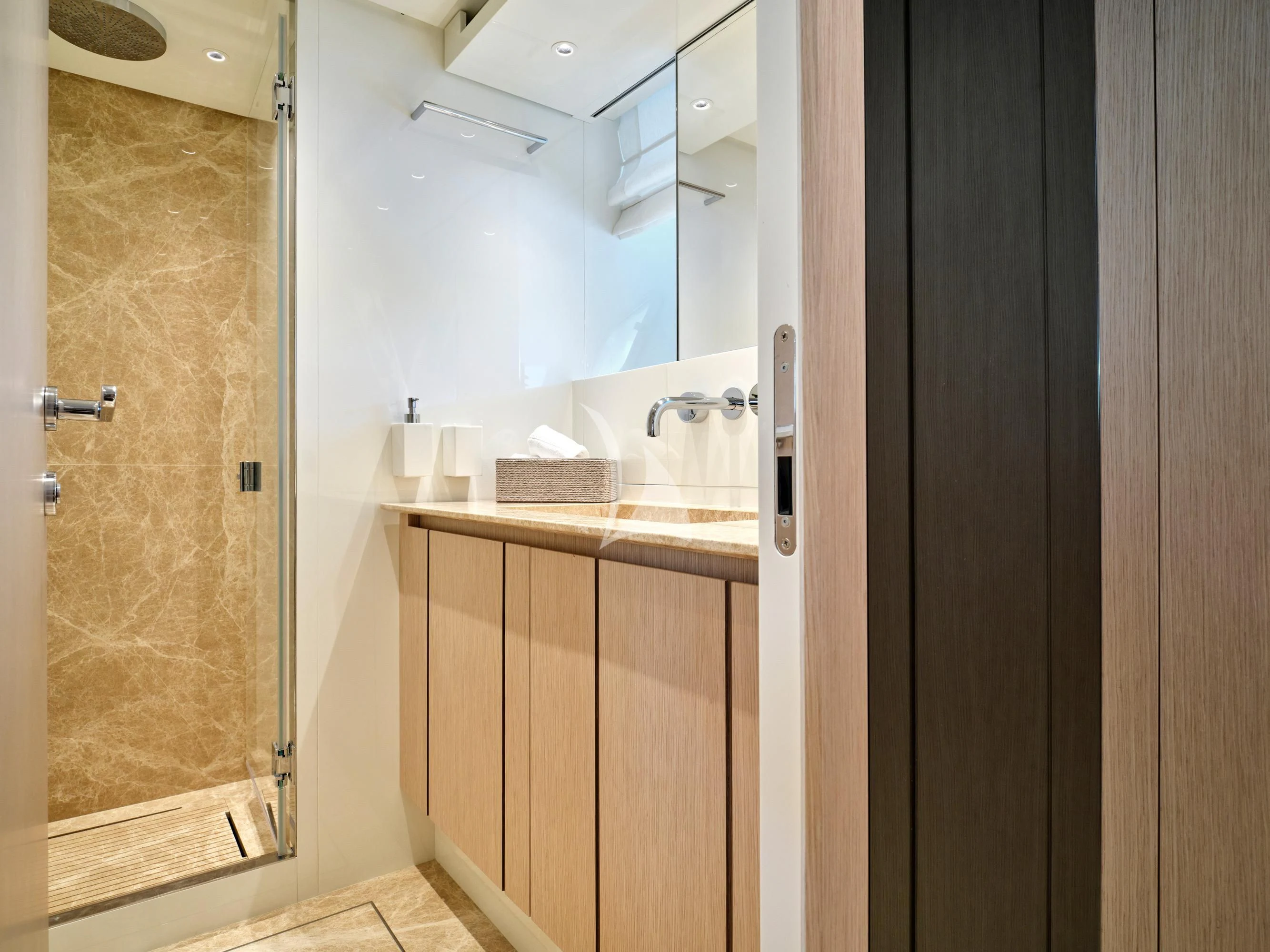 a bathroom with a glass shower aboard ZILVAR IV Yacht for Sale