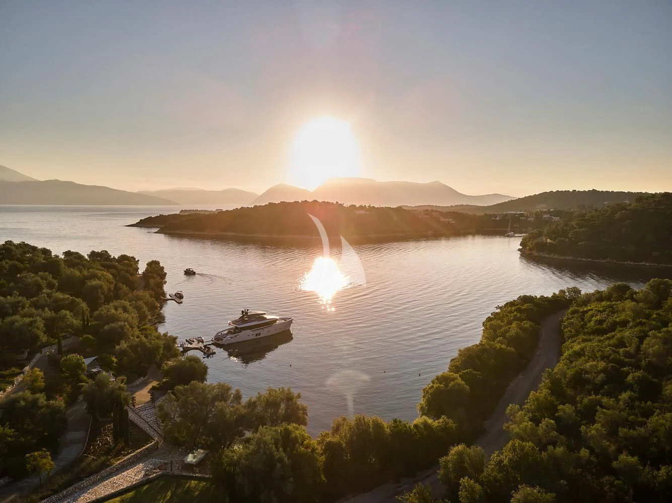 a body of water with boats and trees around it aboard ZILVAR IV Yacht for Sale