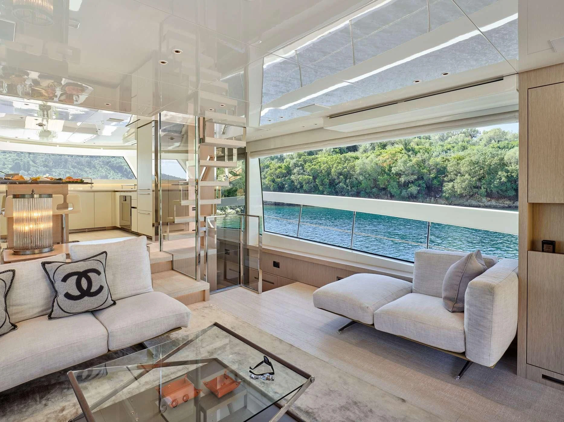 a living room with a large window aboard ZILVAR IV Yacht for Sale