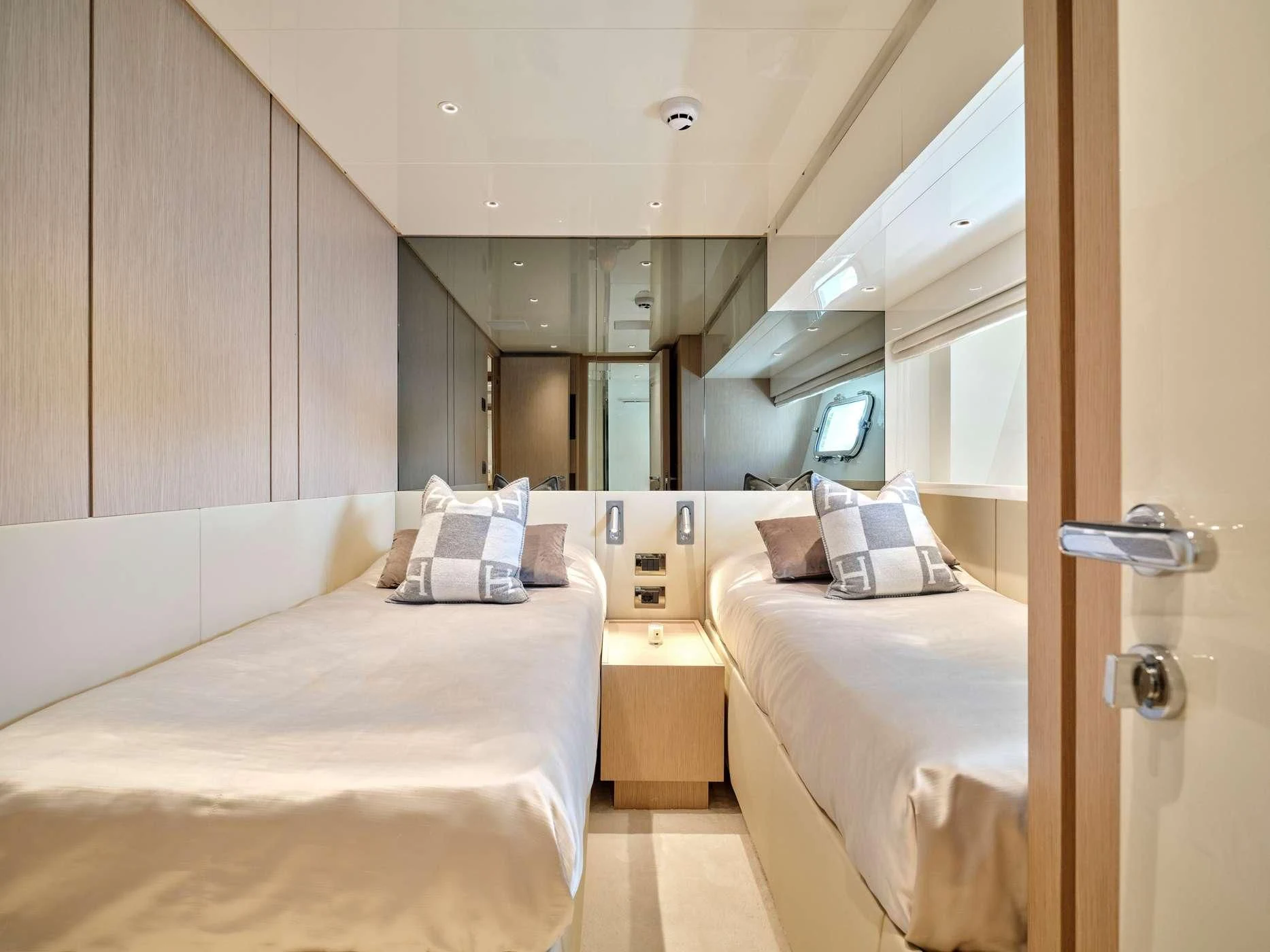 a room with two beds aboard ZILVAR IV Yacht for Sale