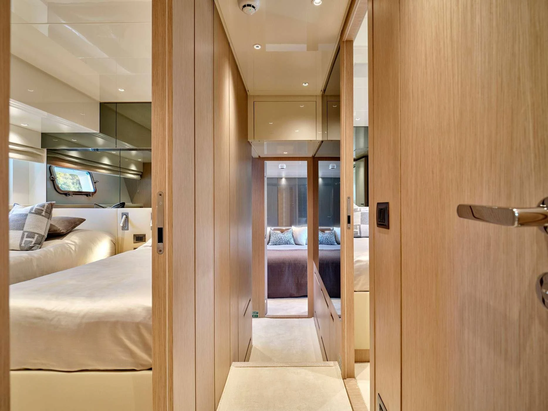 a room with a bed and a door aboard ZILVAR IV Yacht for Sale