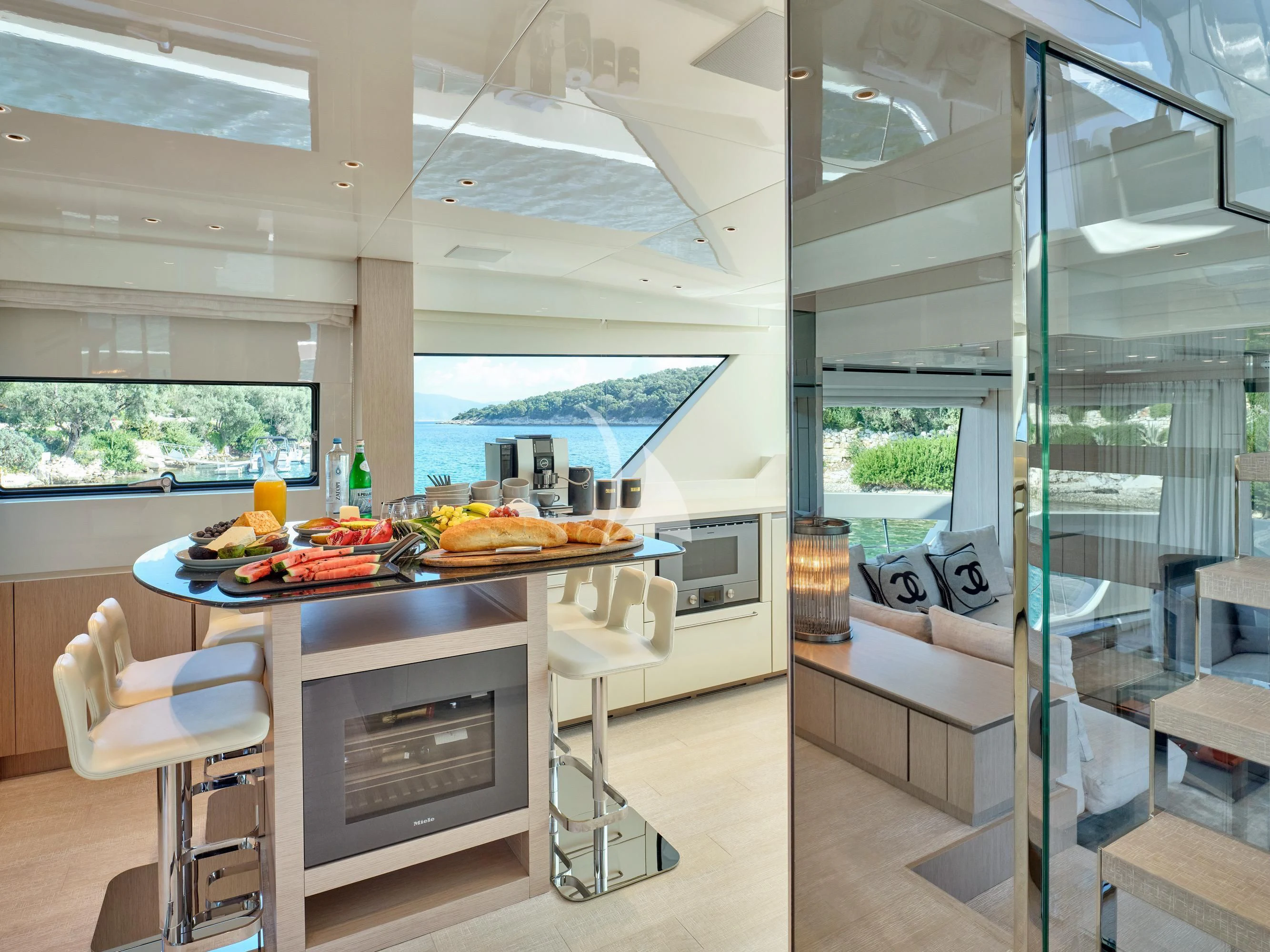 a kitchen with a table and chairs aboard ZILVAR IV Yacht for Sale