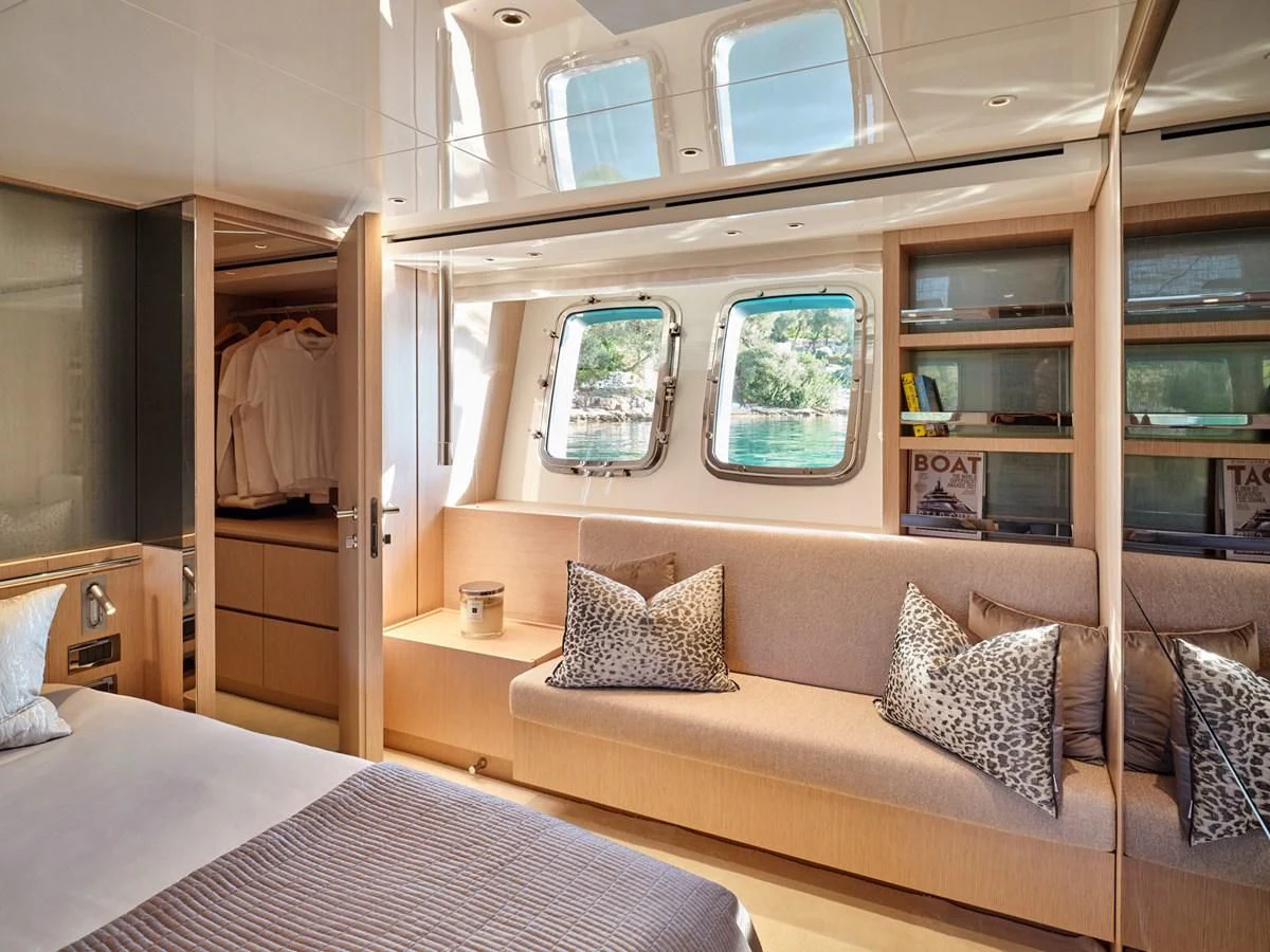 a bed in a room aboard ZILVAR IV Yacht for Sale