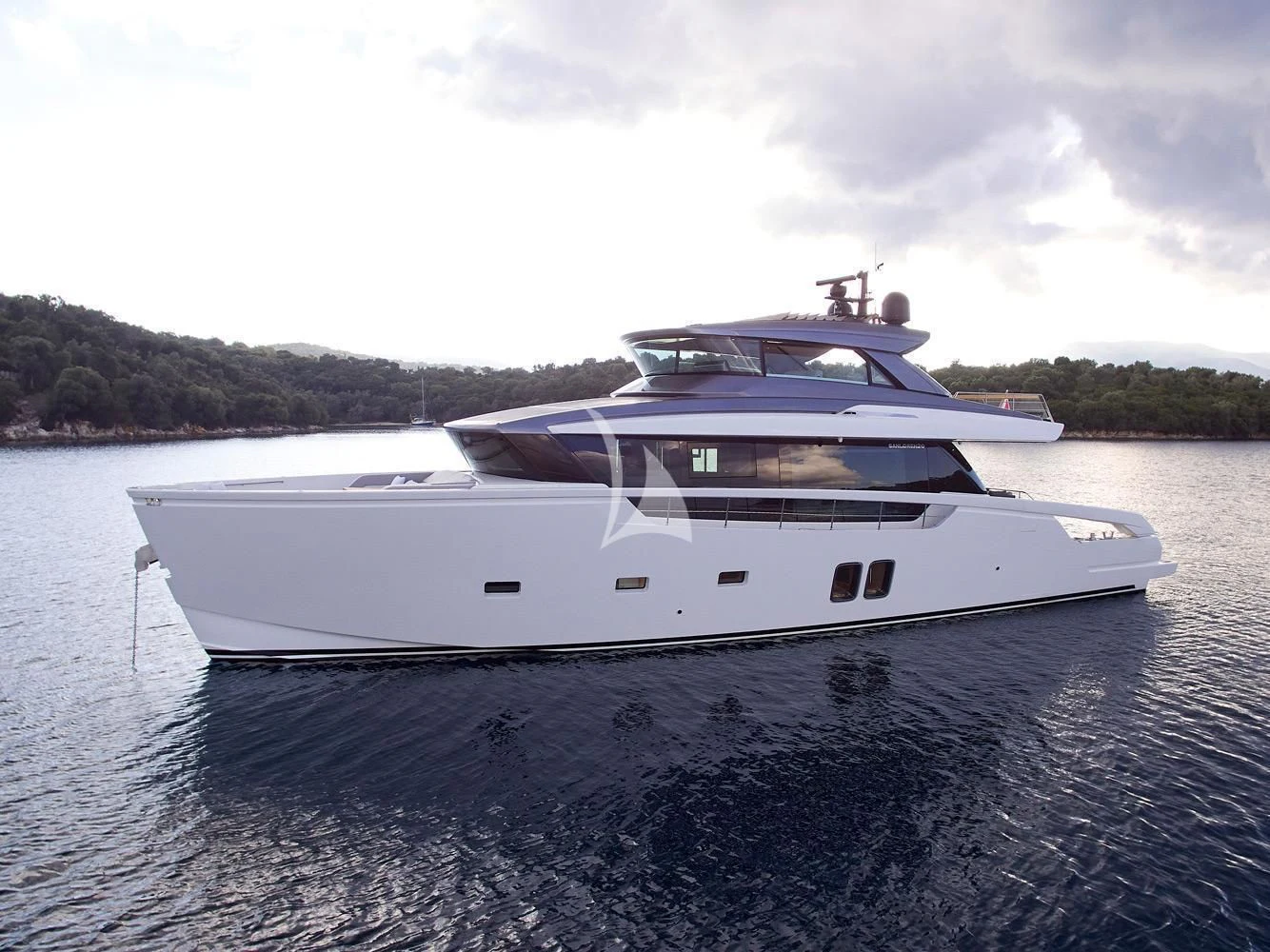 a white yacht on the water aboard ZILVAR IV Yacht for Sale