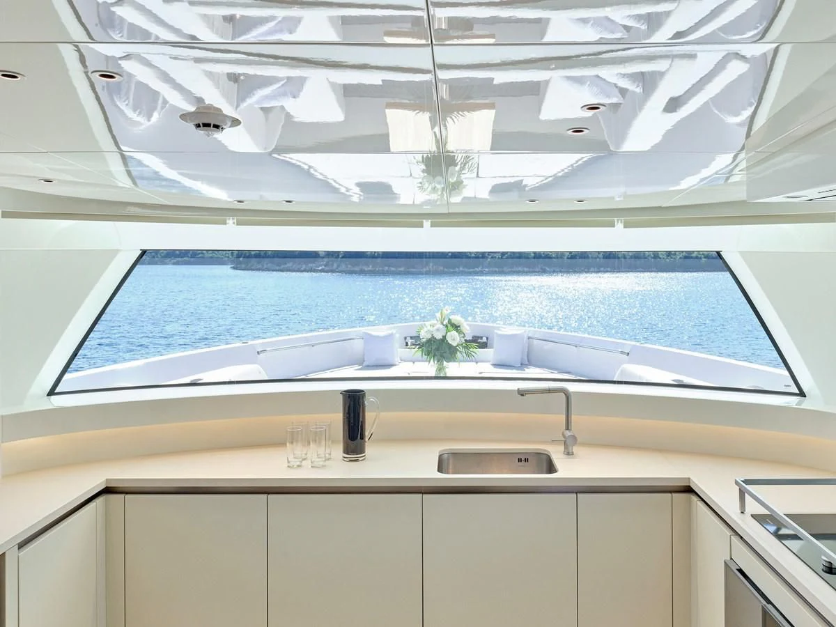 a kitchen with a sink and a window aboard ZILVAR IV Yacht for Sale