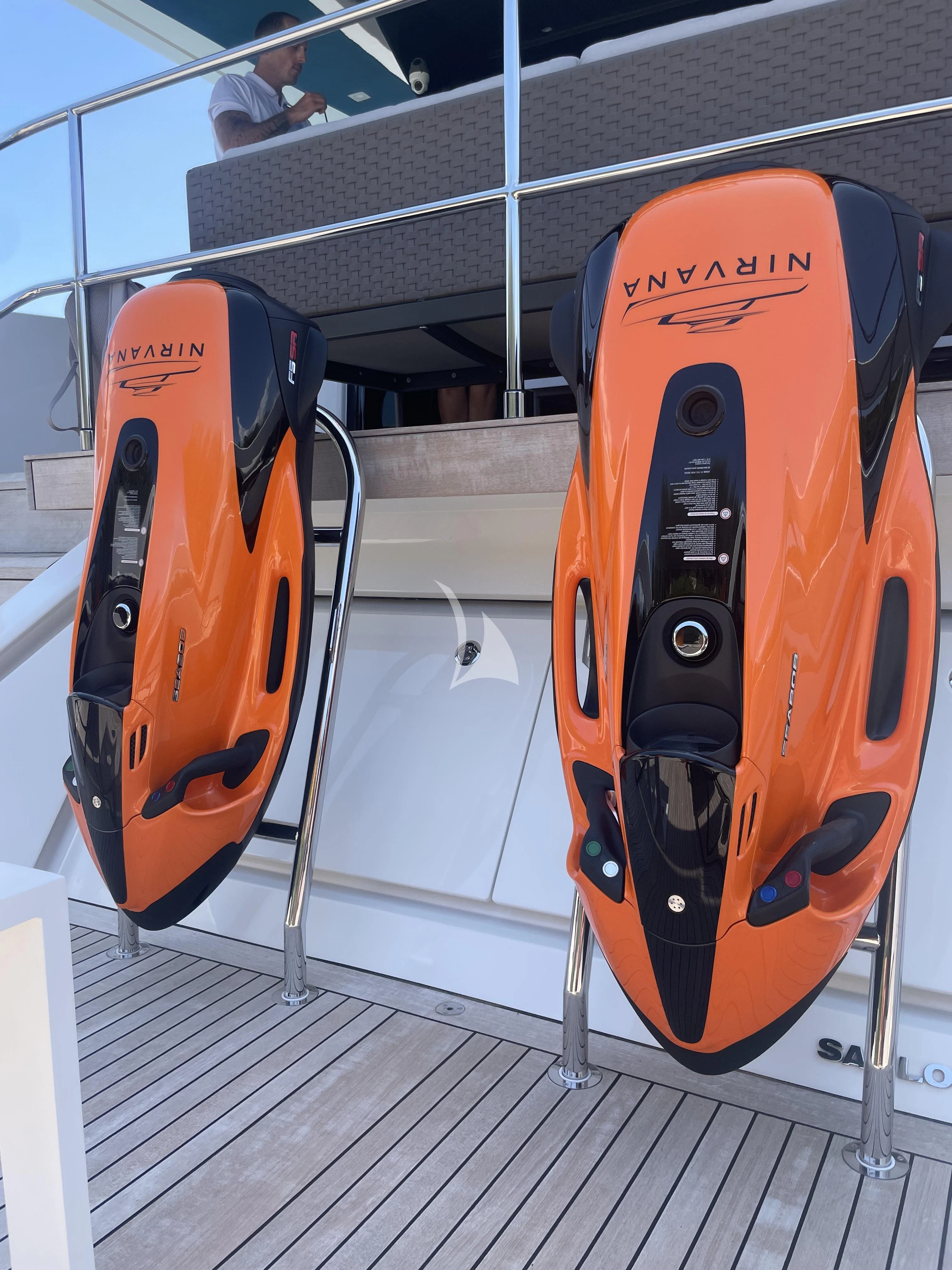 a pair of orange and black surfboards on a wooden surface aboard ZILVAR IV Yacht for Sale