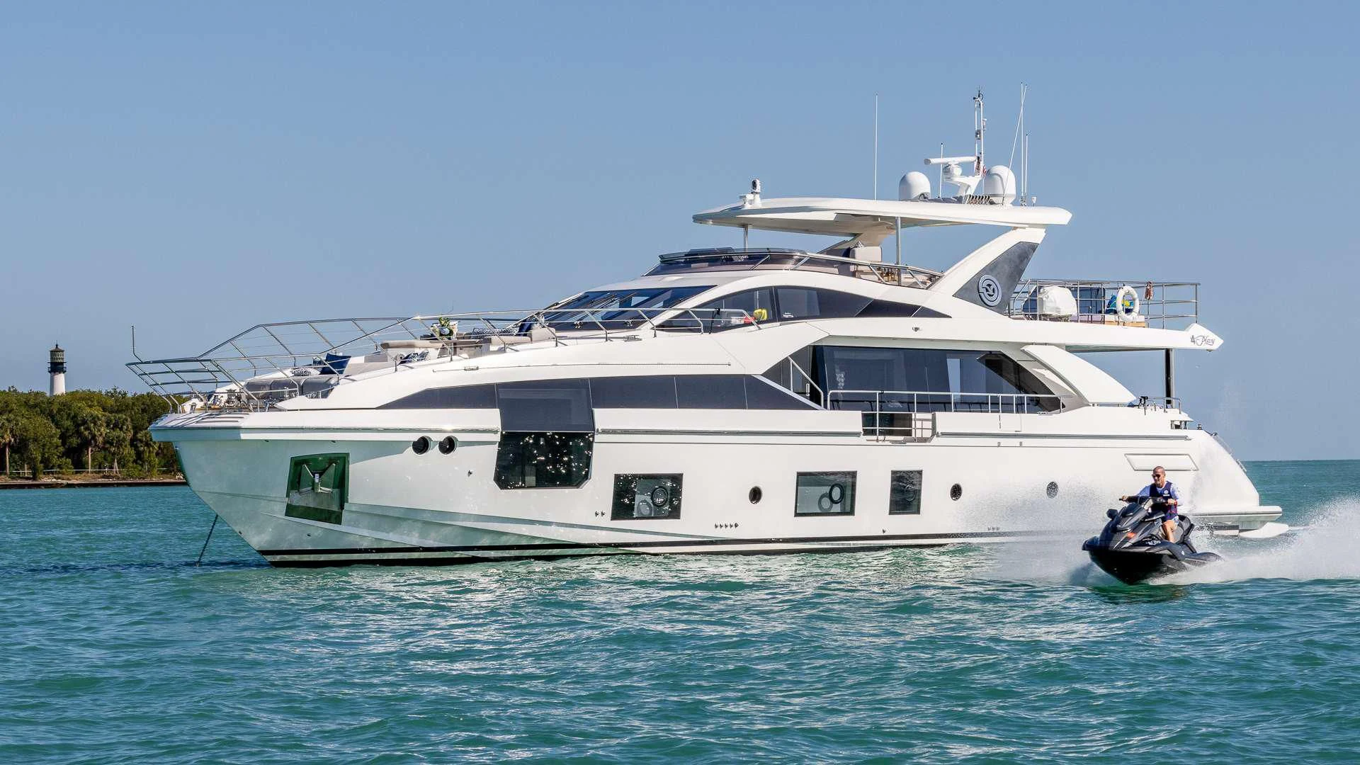 a white yacht on the water aboard CAPTAIN MORGAN II Yacht for Sale