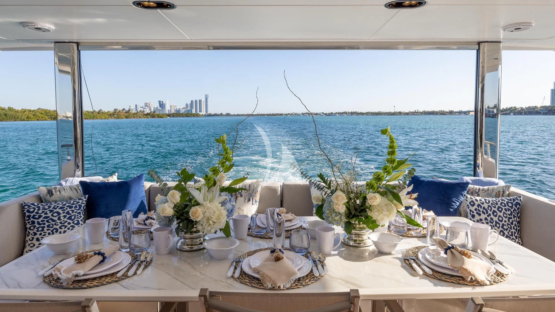 a table set with place settings aboard CAPTAIN MORGAN II Yacht for Sale